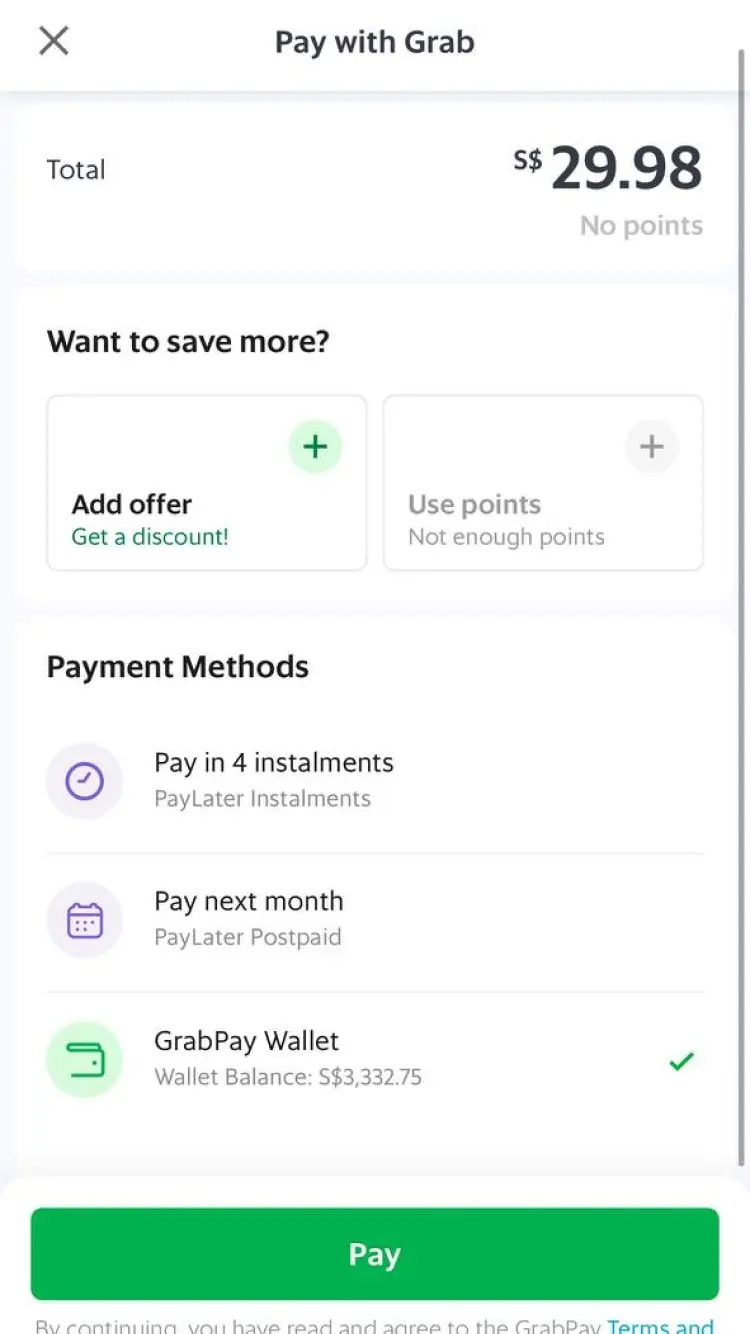 Mobile payment screen with options to add an offer, use points, and select payment method using GrabPay Wallet.