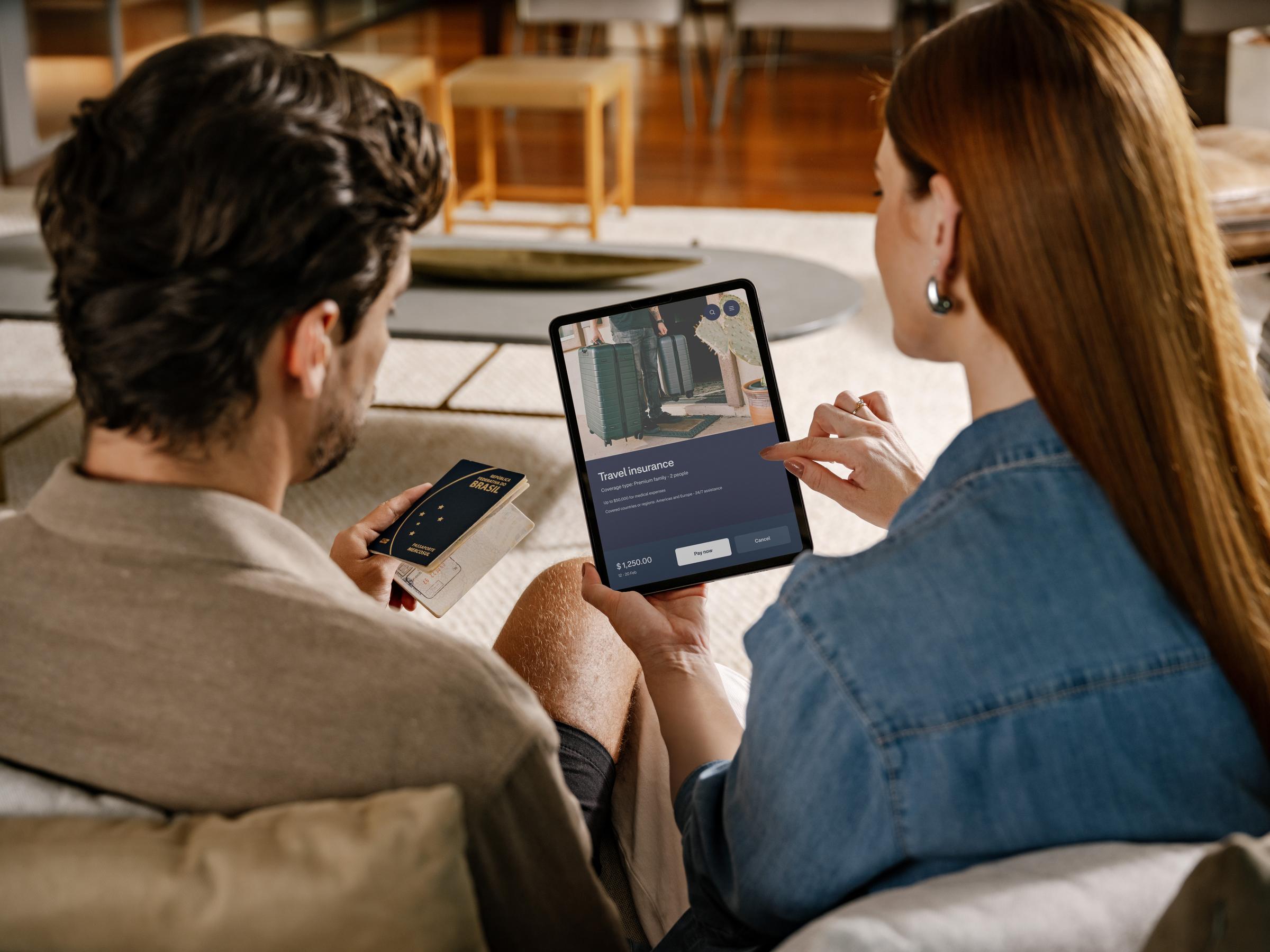 couple paying their travel insurance