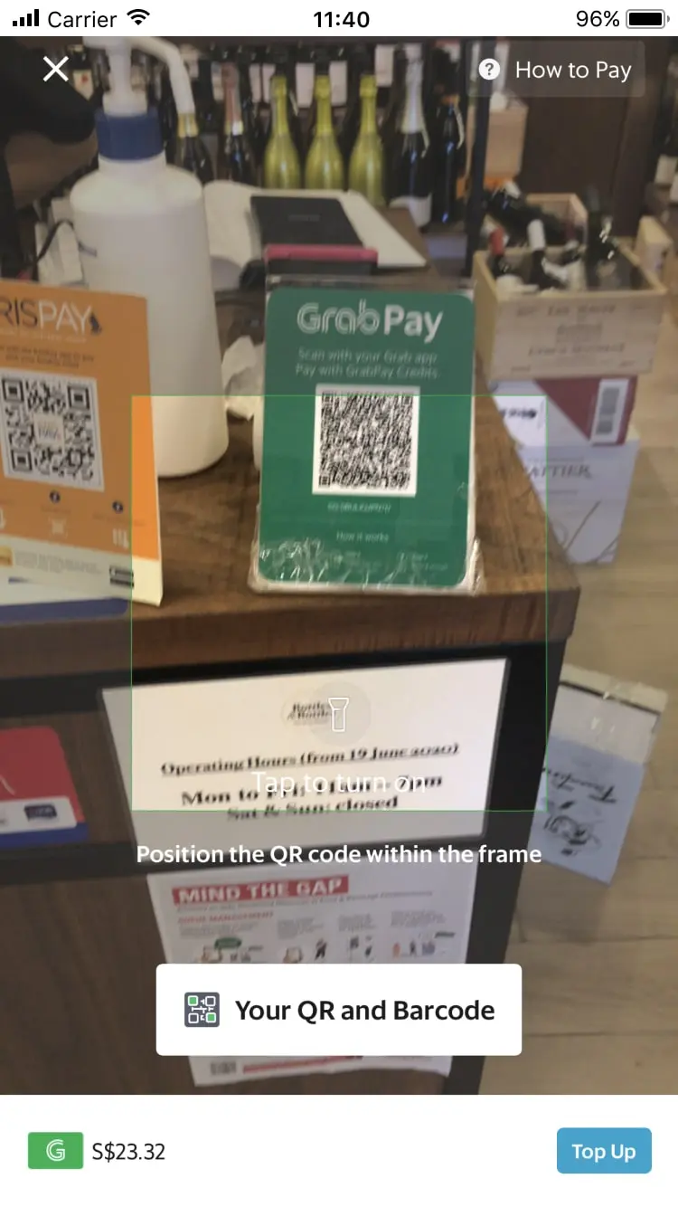 Mobile payment screen displaying QR code for GrabPay with a total charge of $23.32.
