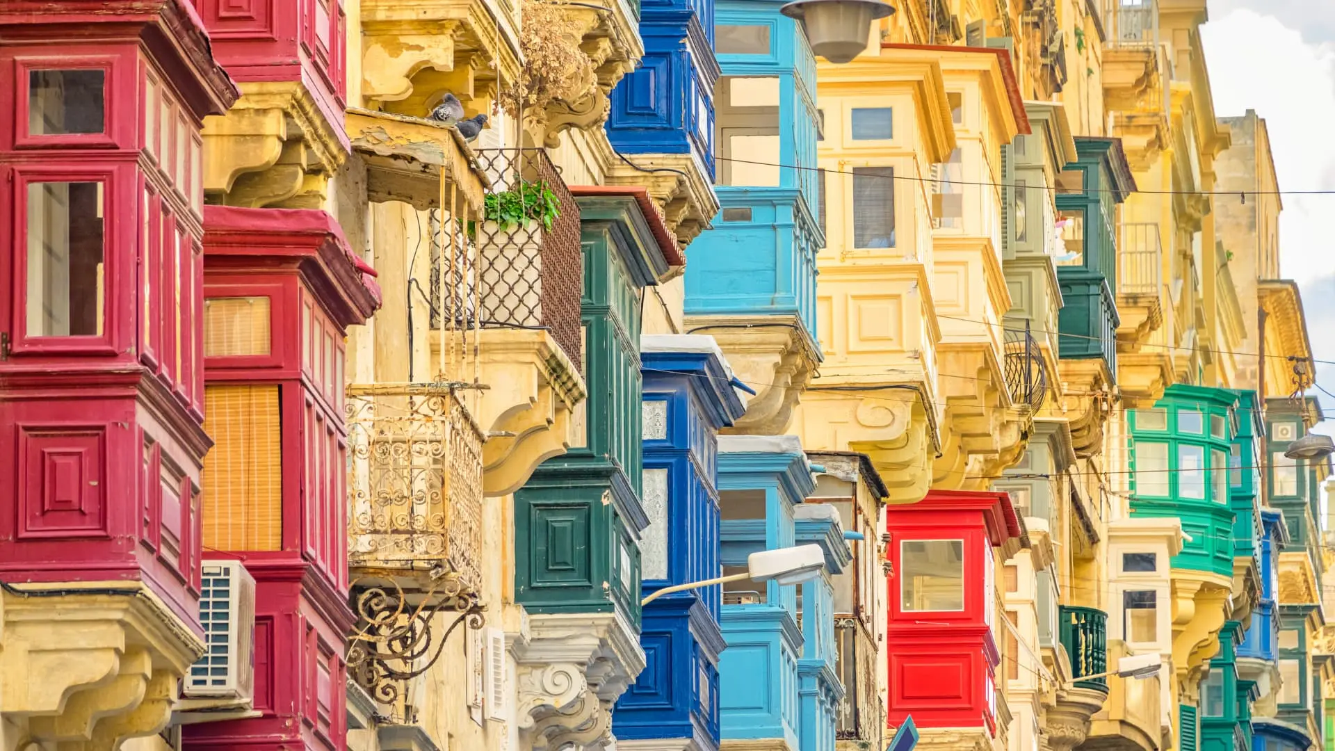Colorful traditional Maltese balconies in Valletta, Malta.