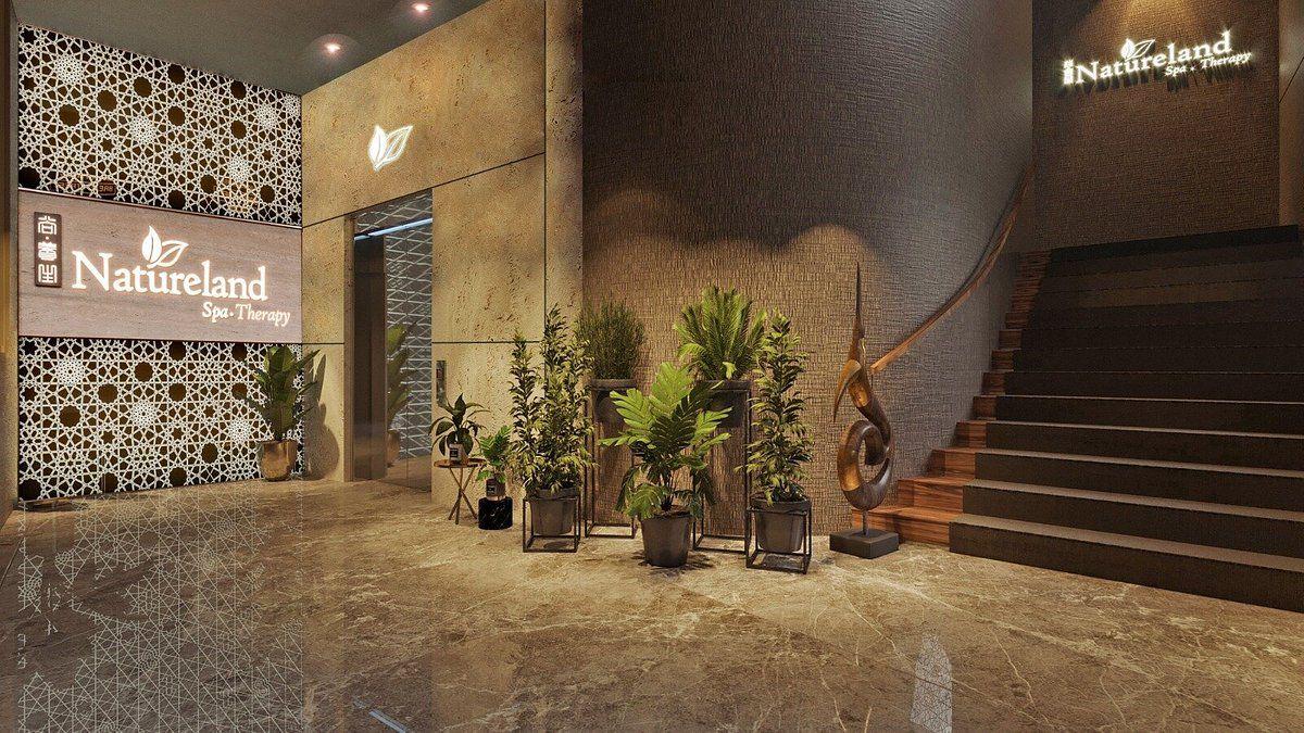 Interior of a wellness spa with plants and the Natureland Spa Therapy sign.
