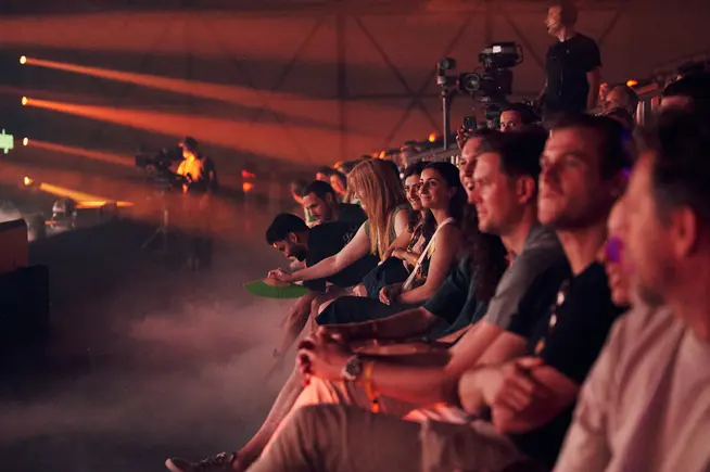 Groups of people in an audience during sales event of Adyen