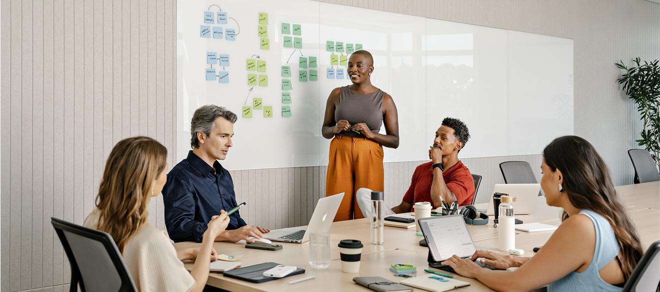 a group of people having a conversation in a meeting