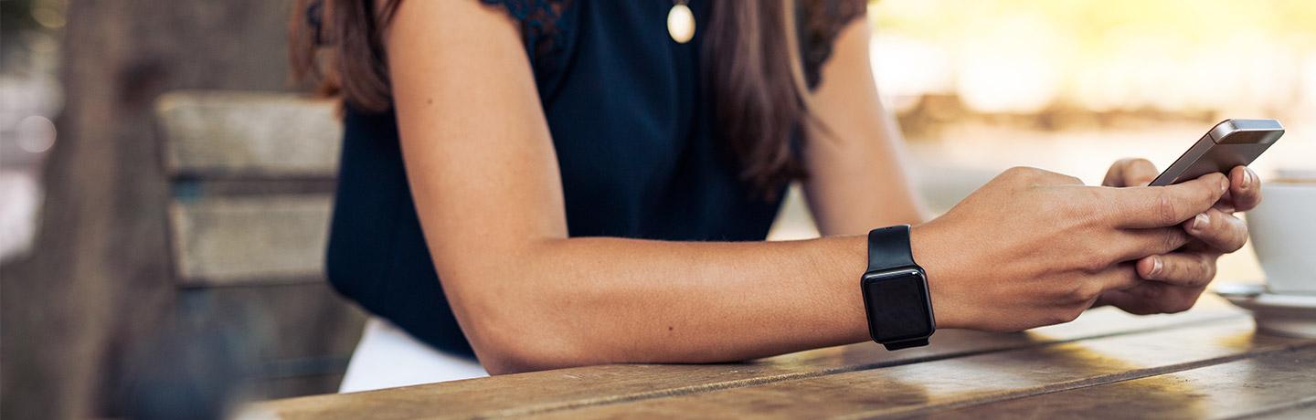 Close up image of Apple watch and iPhone 