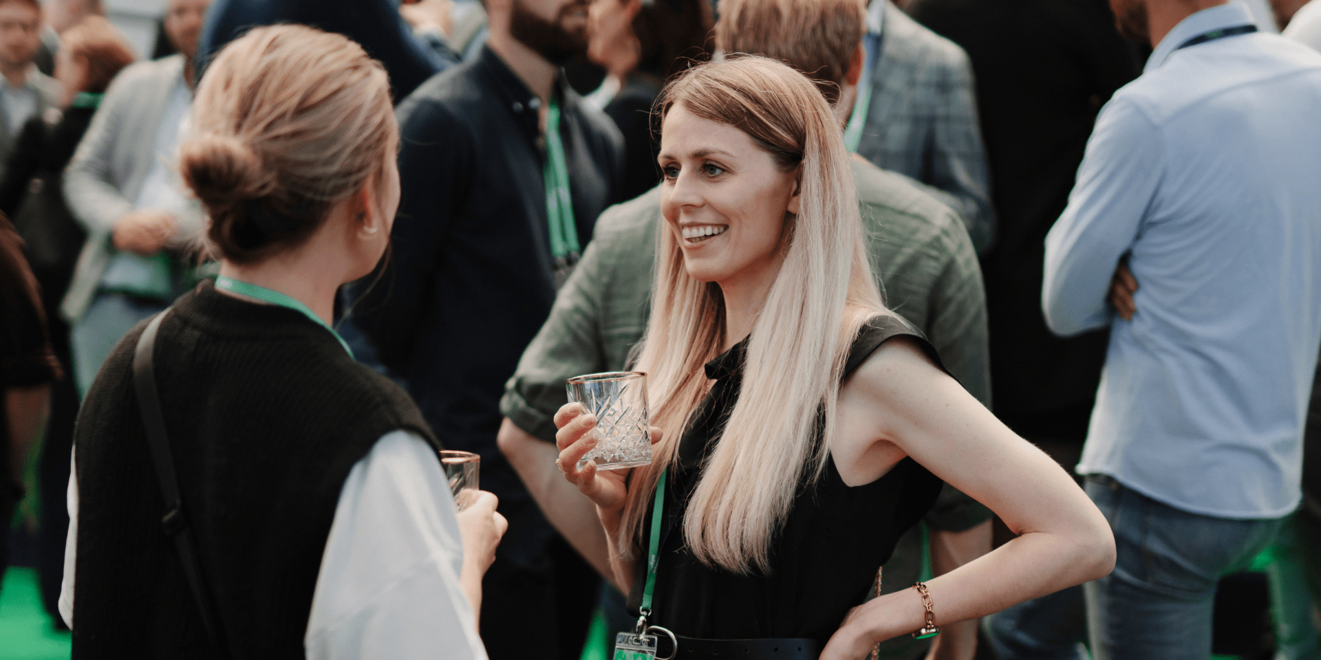 Lady with a drink in a social setting