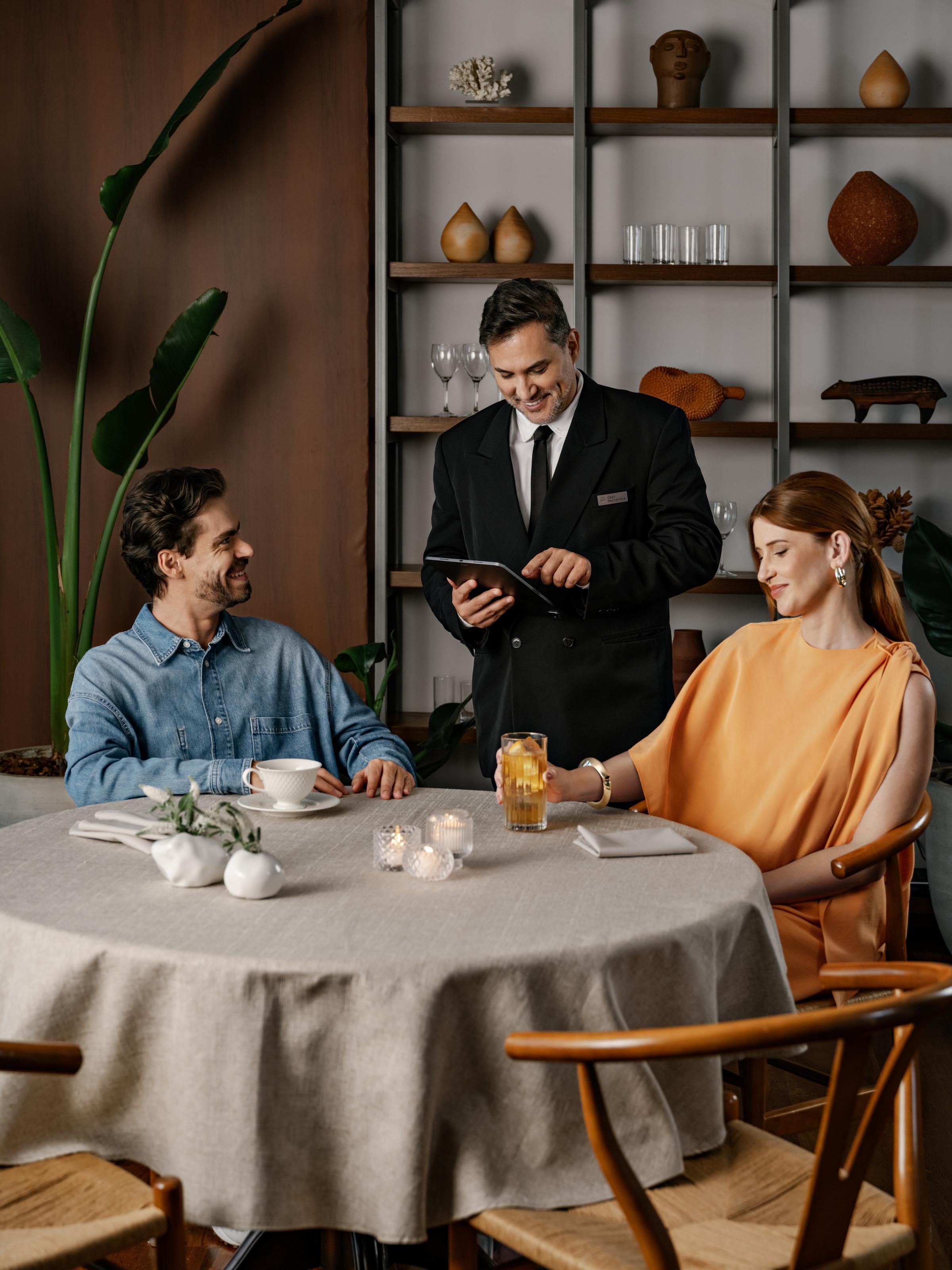couple ordering coffee at hotel lobby