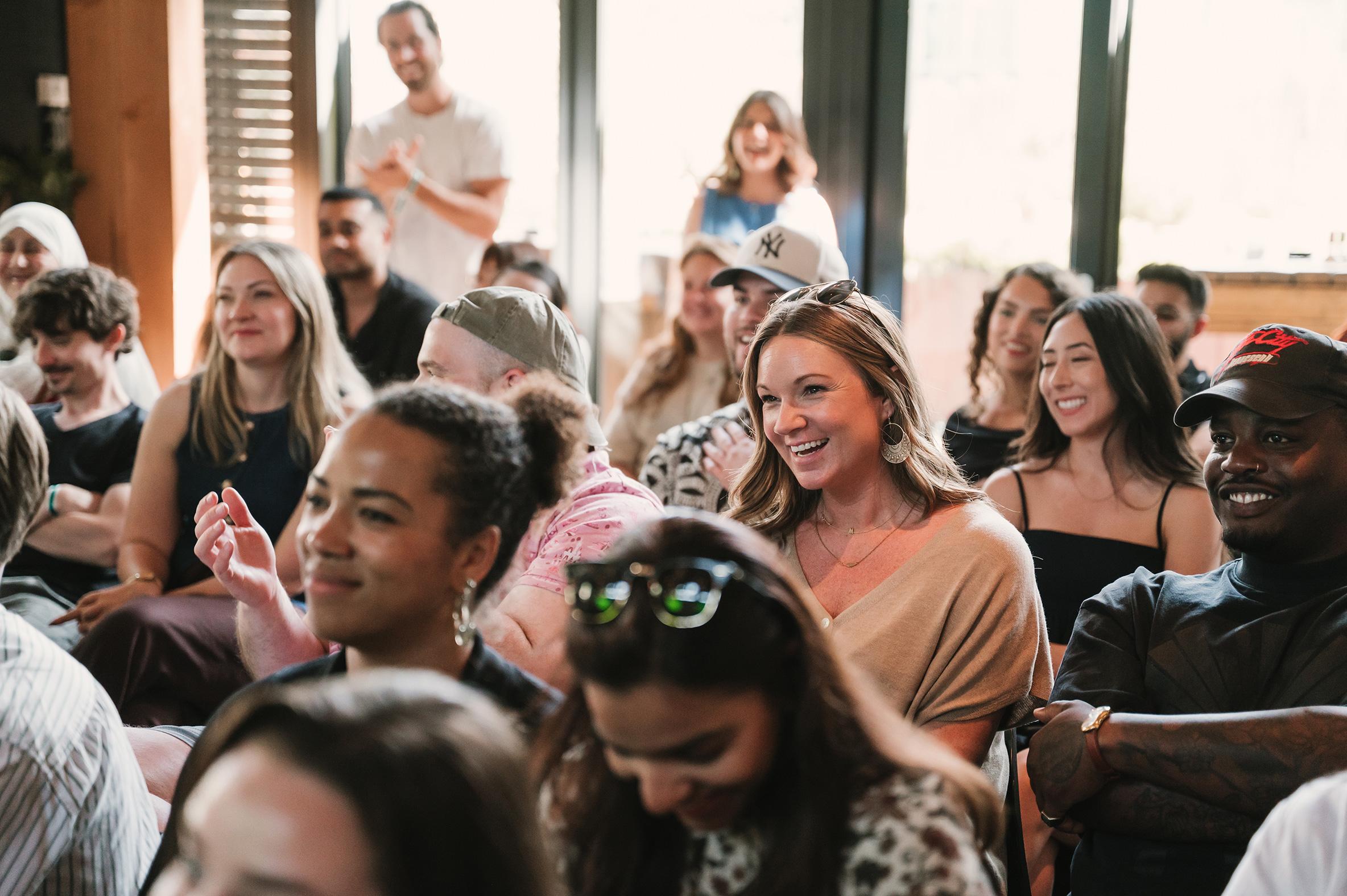 Adyen team members engaging in a lively discussion at an internal meeting.