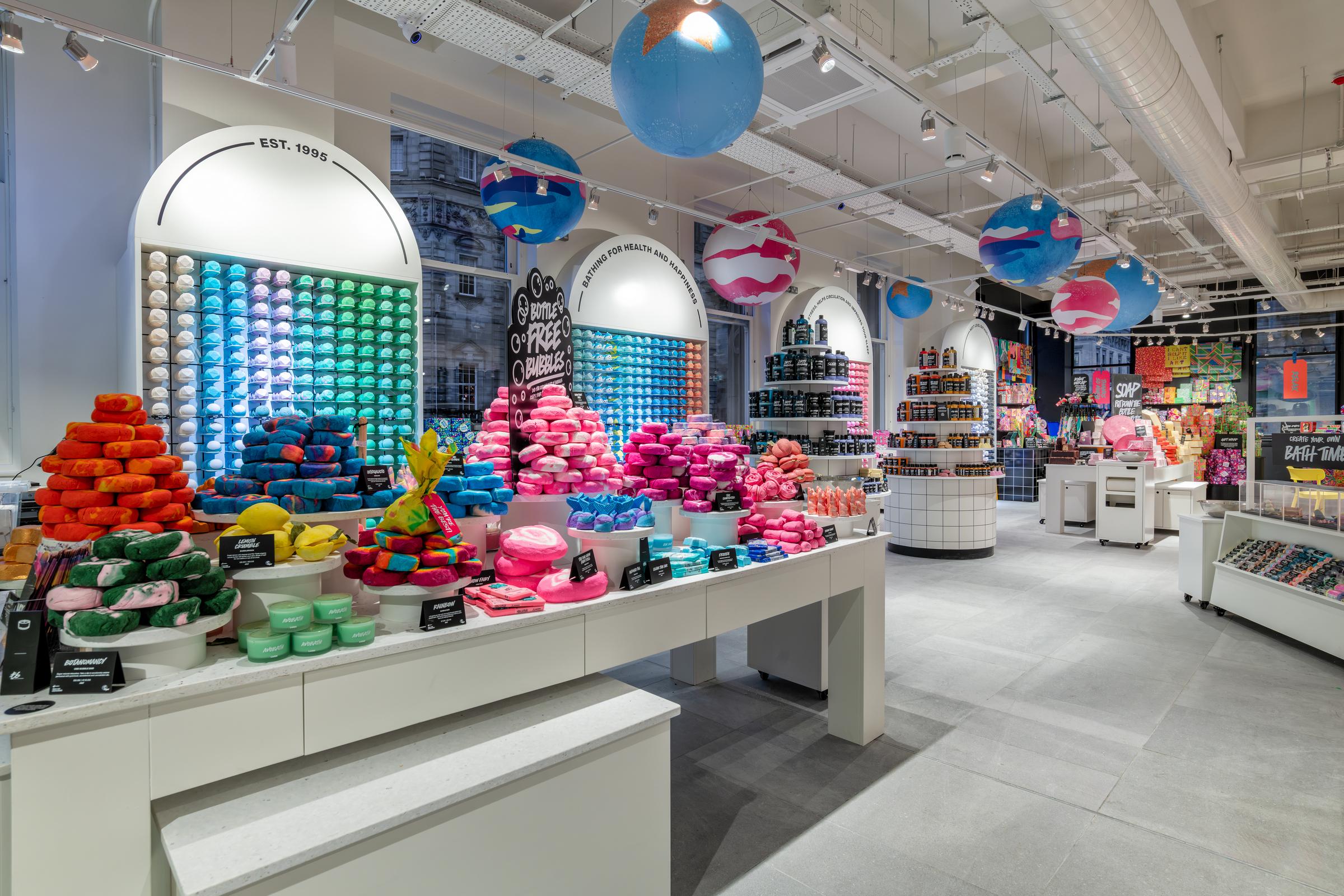 Interior of Glasgow Lush store with colorful bath products on display.