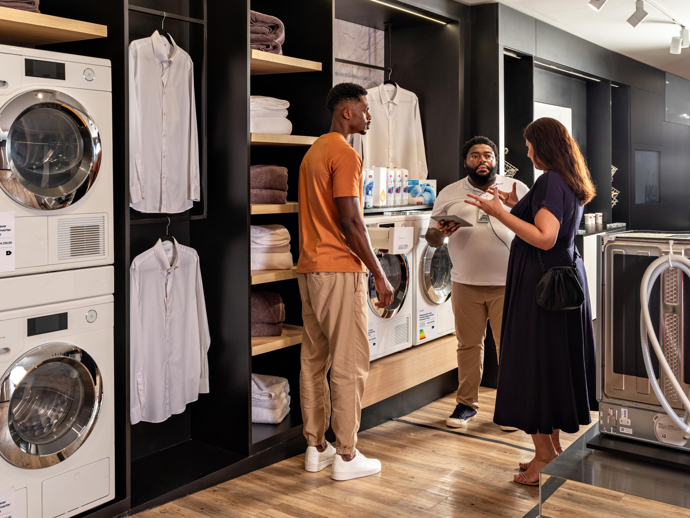 Shopping in white goods store for washing machine and other electronics