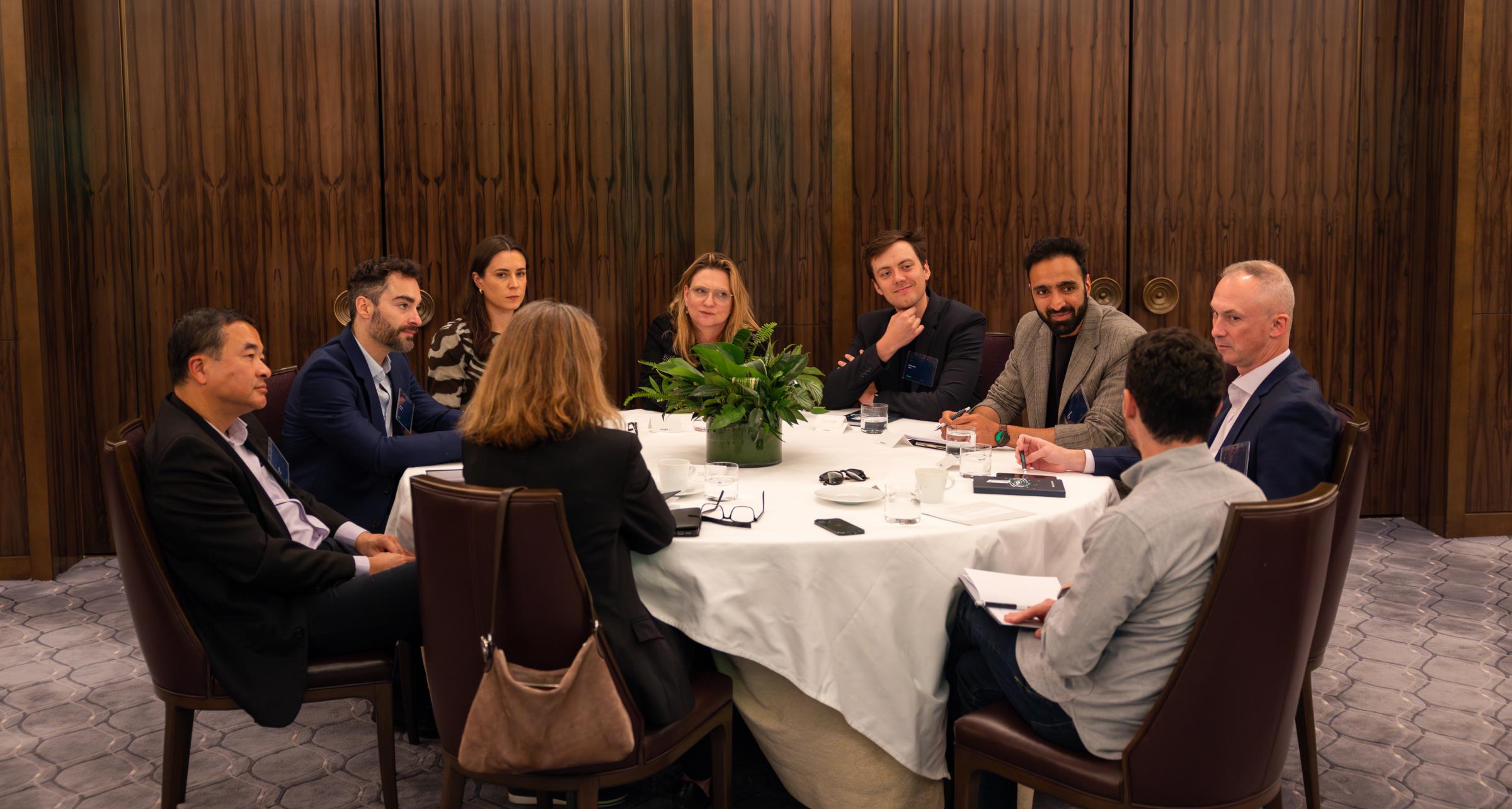 Adyen team members in a meeting at a conference table in a professional setting