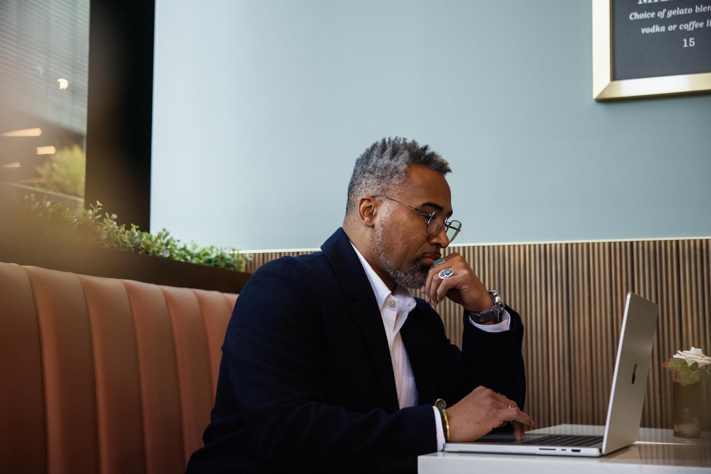 Adyen team member working on a laptop in the office environment