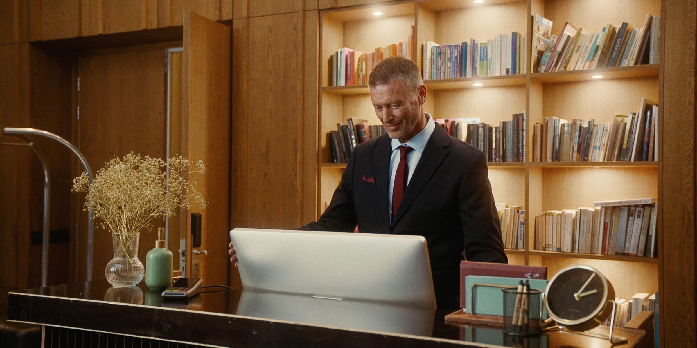 Hotel receptionist checking the computer data