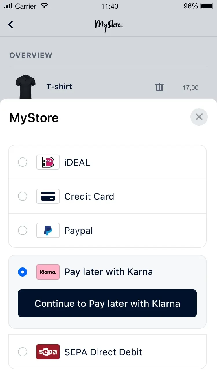 Pantalla móvil que muestra opciones de pago, incluyendo iDEAL, tarjeta de crédito, Paypal, pagar más tarde con Klarna y débito directo SEPA.