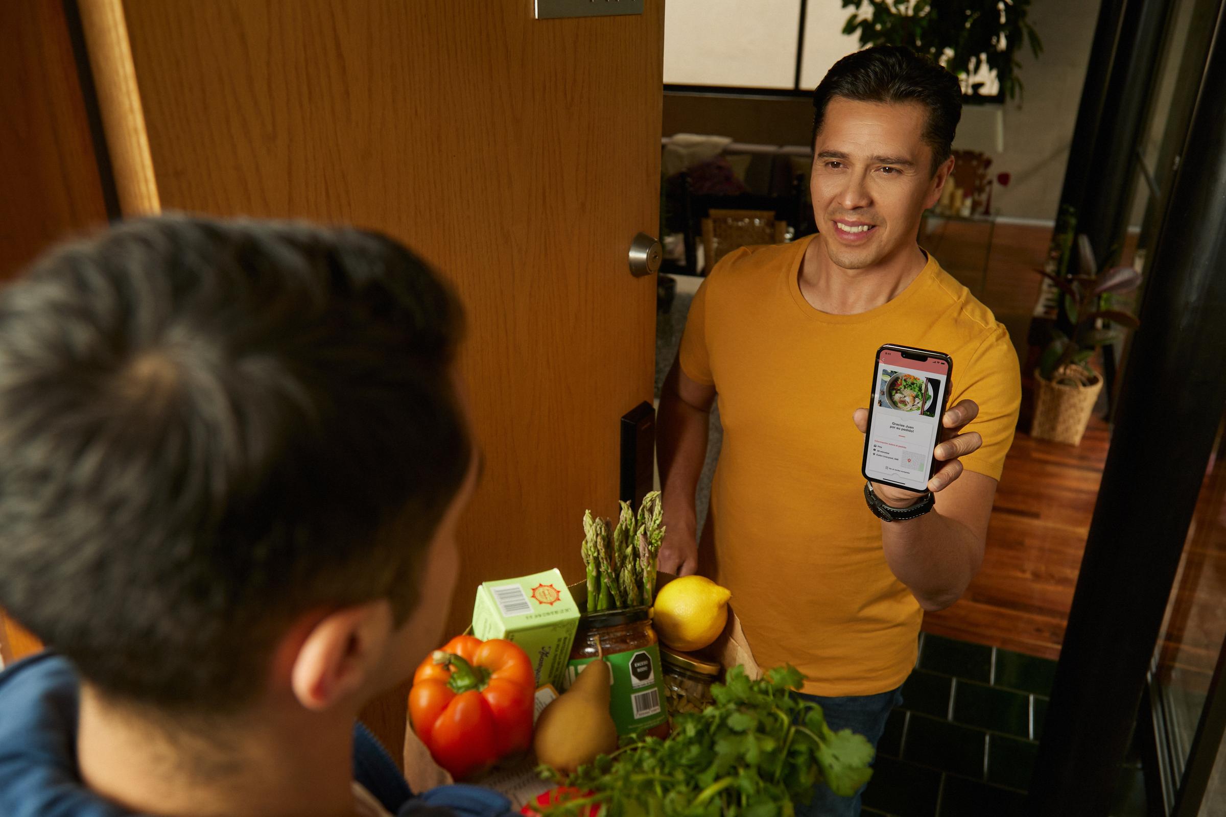 couple at home in their kitchen ordering groceries