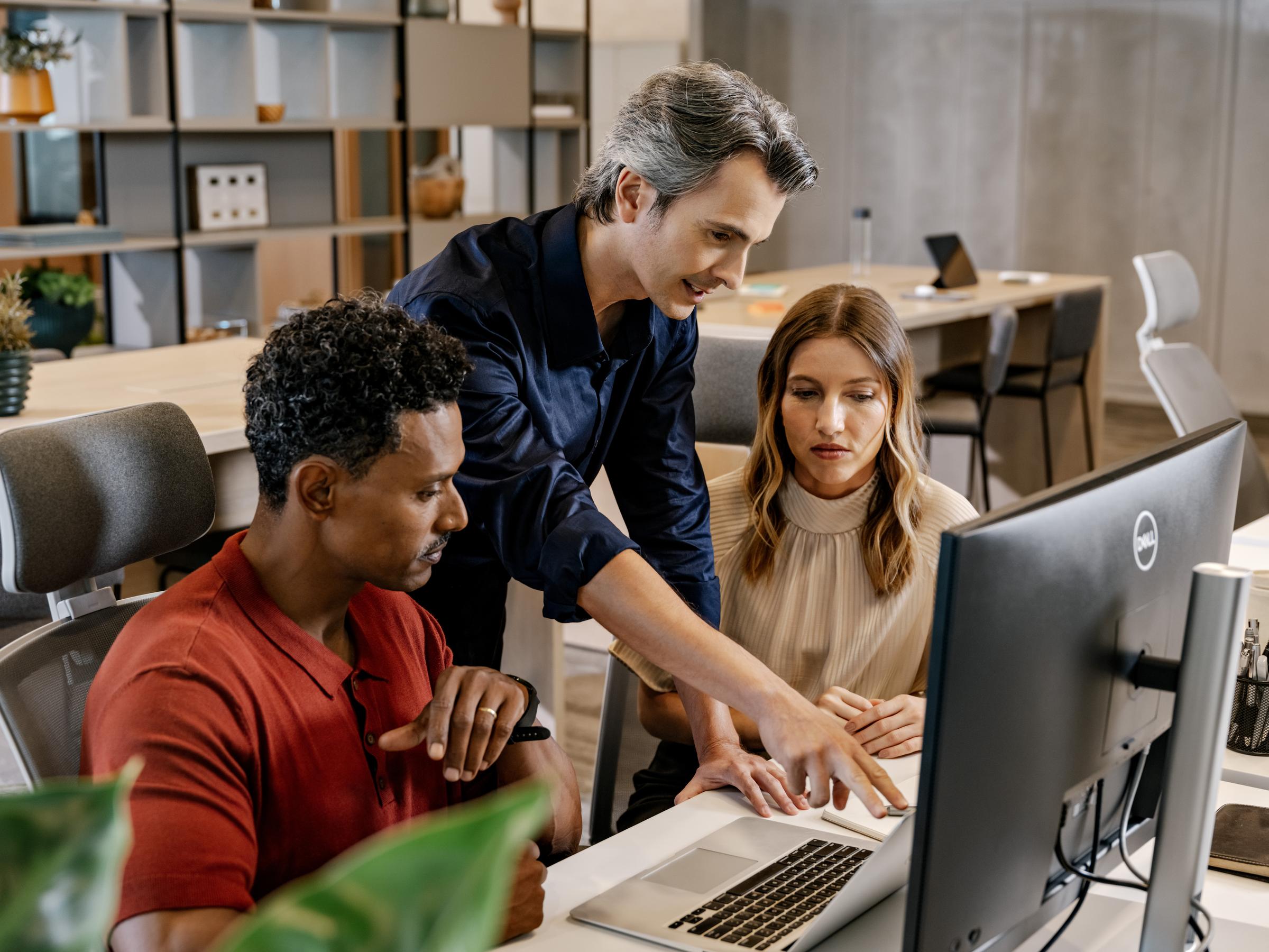 three people in a informal meeting