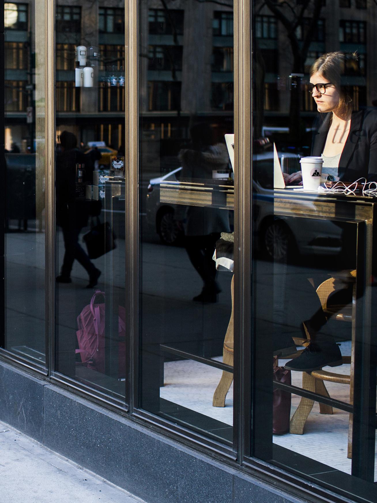 Avocado toast with an egg on a white plate.