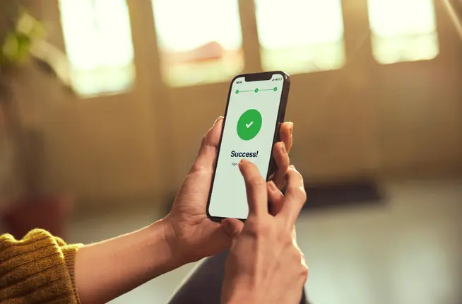 Person on phone that says success