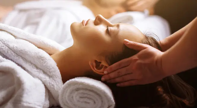 Woman getting a head massage