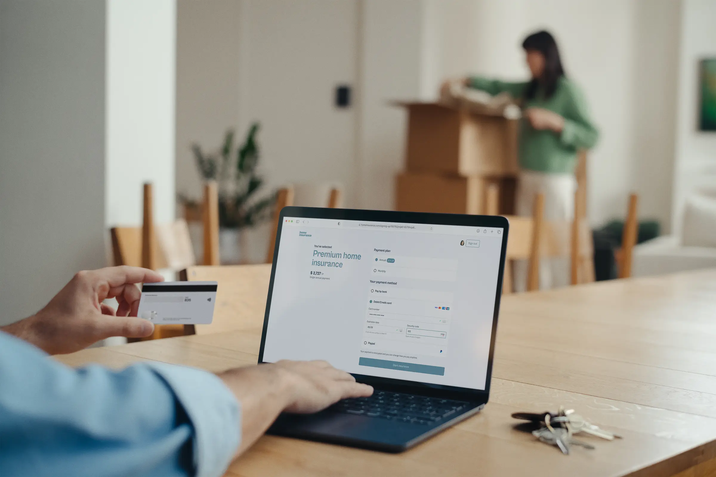 People unpacking and finishing home insurance subscription