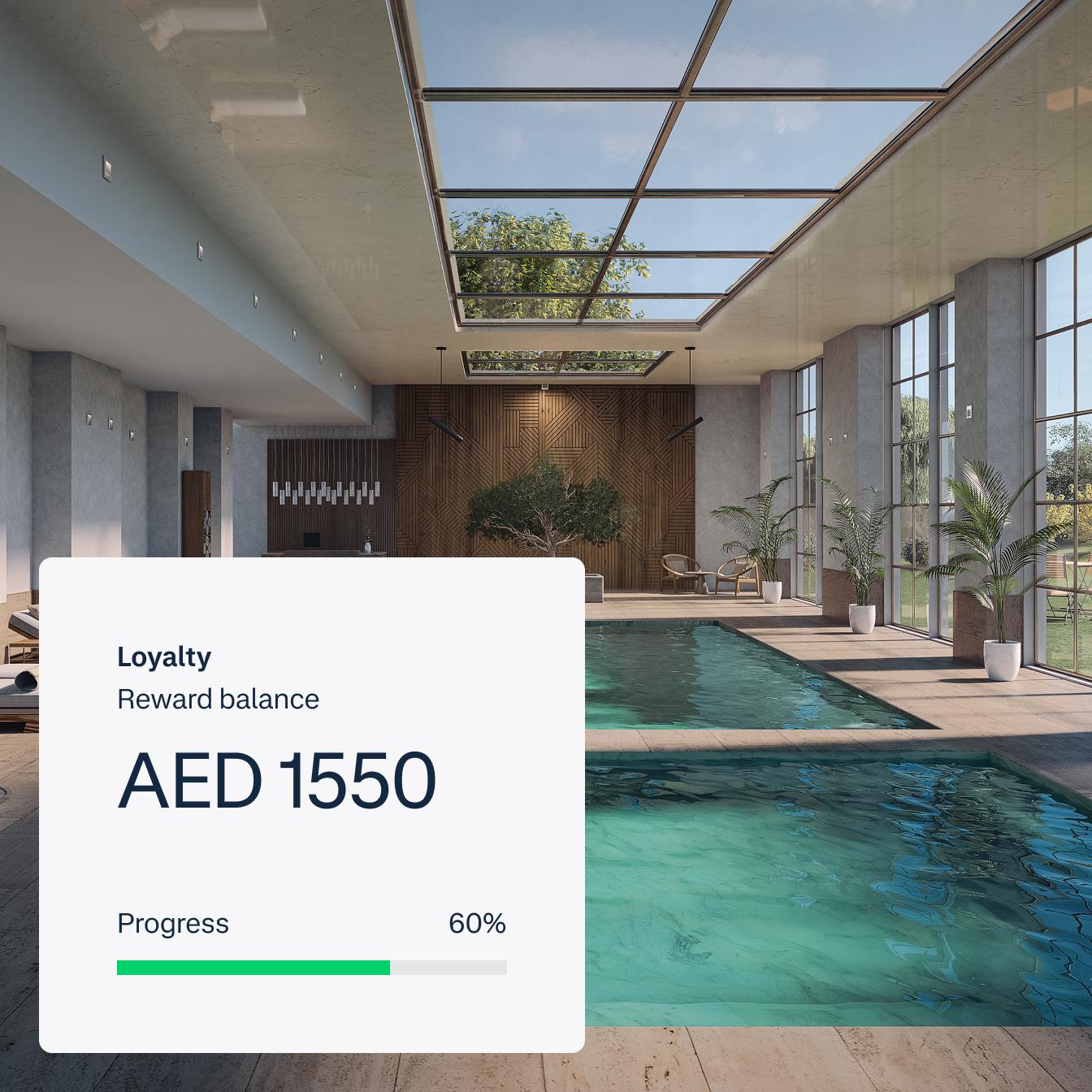 UI screen of loyalty points balance, placed on a photo of an indoor pool, for Index Hospitality
