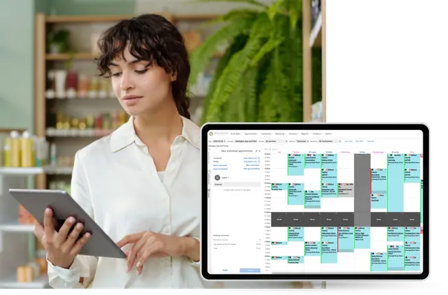 Resort worker on ipad scheduling appointments