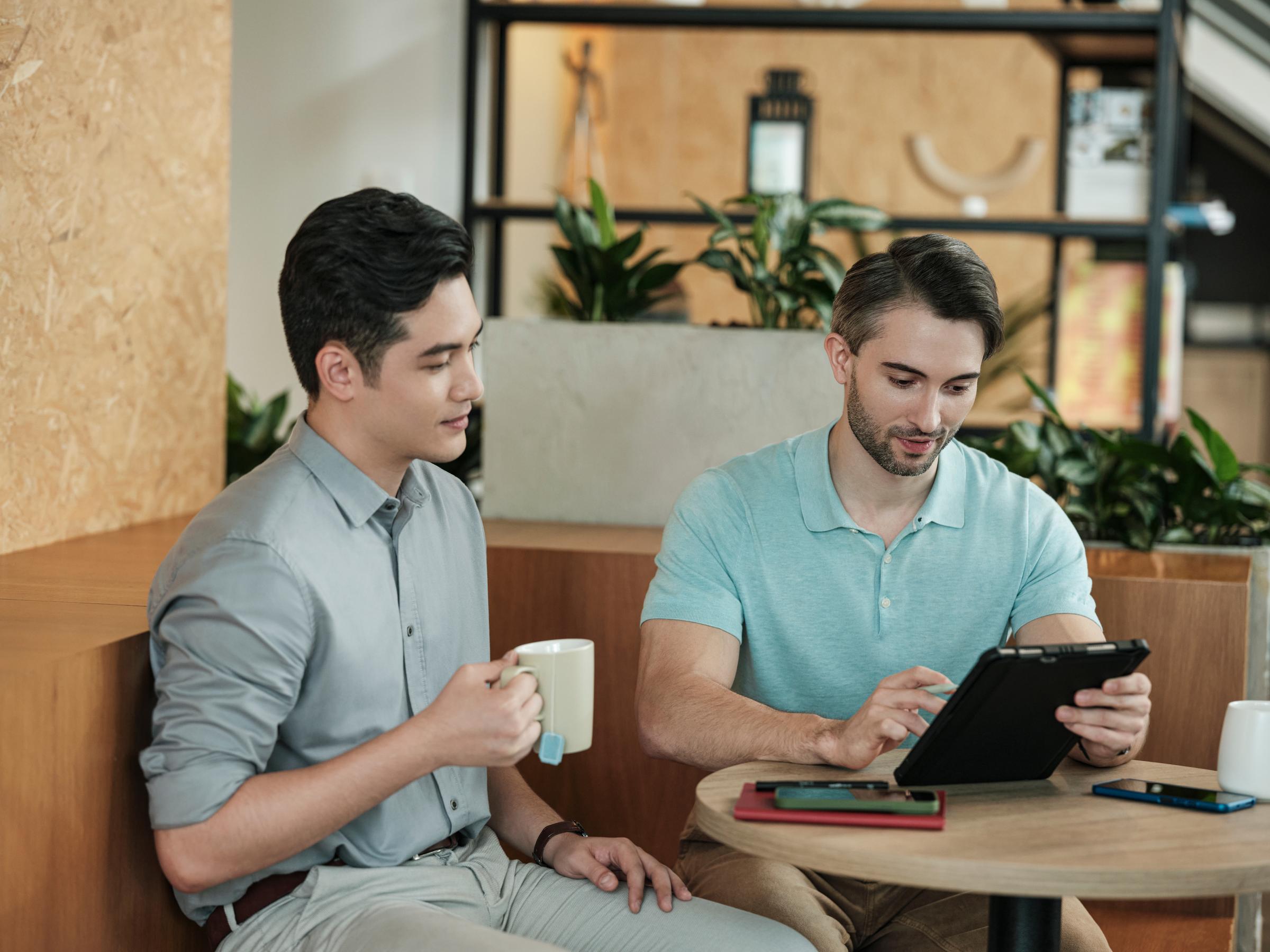 Two men in a meeting with iPad