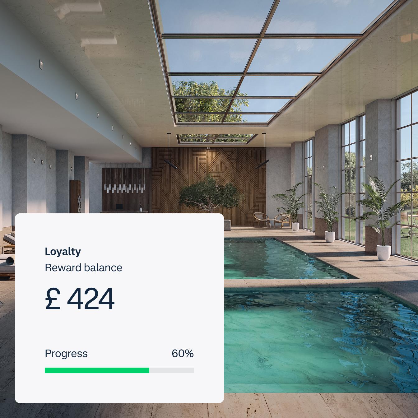 UI screen of loyalty points balance, placed on a photo of an indoor pool, for Index Hospitality