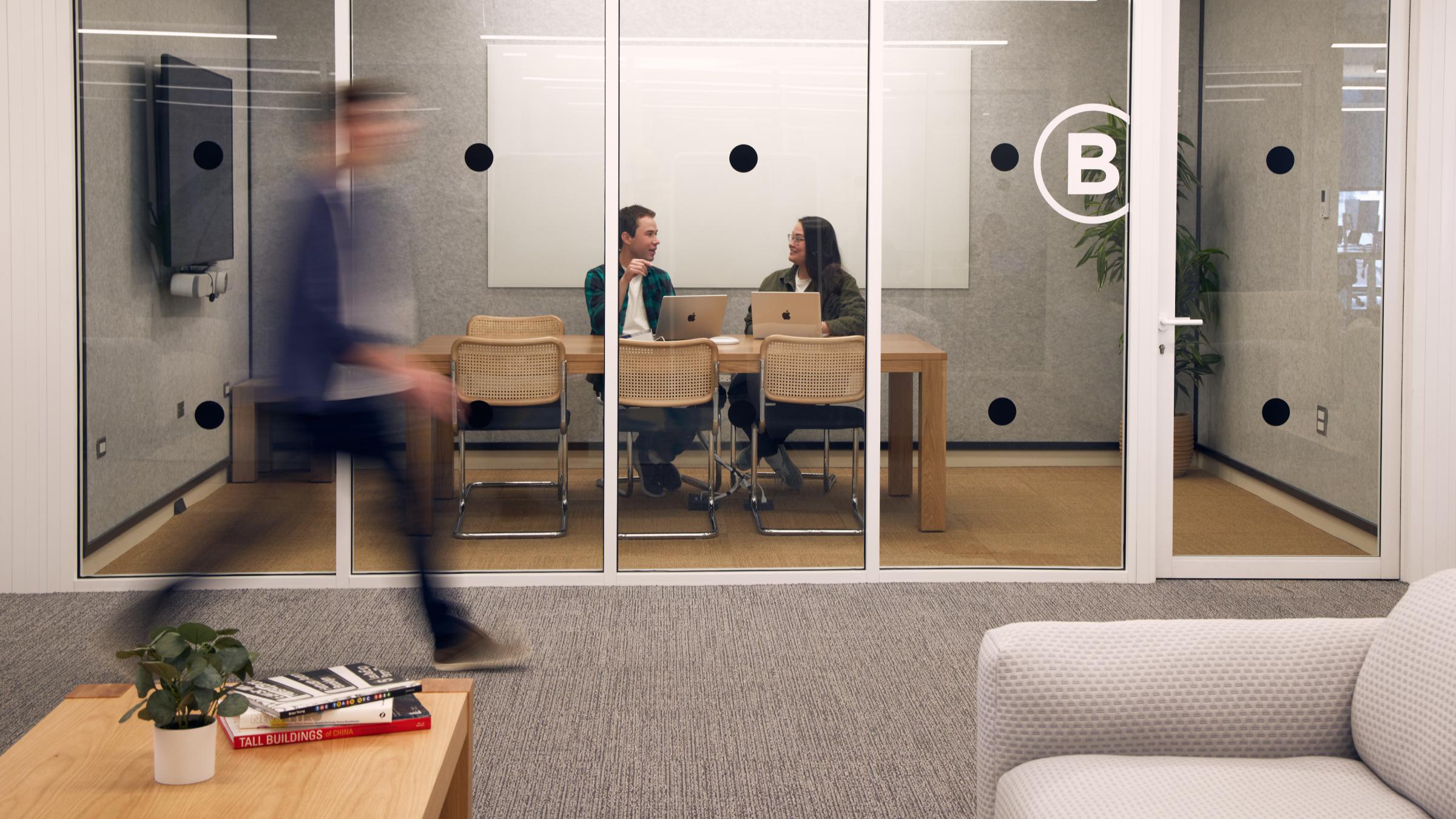 Chicago employees in a meeting and walking by