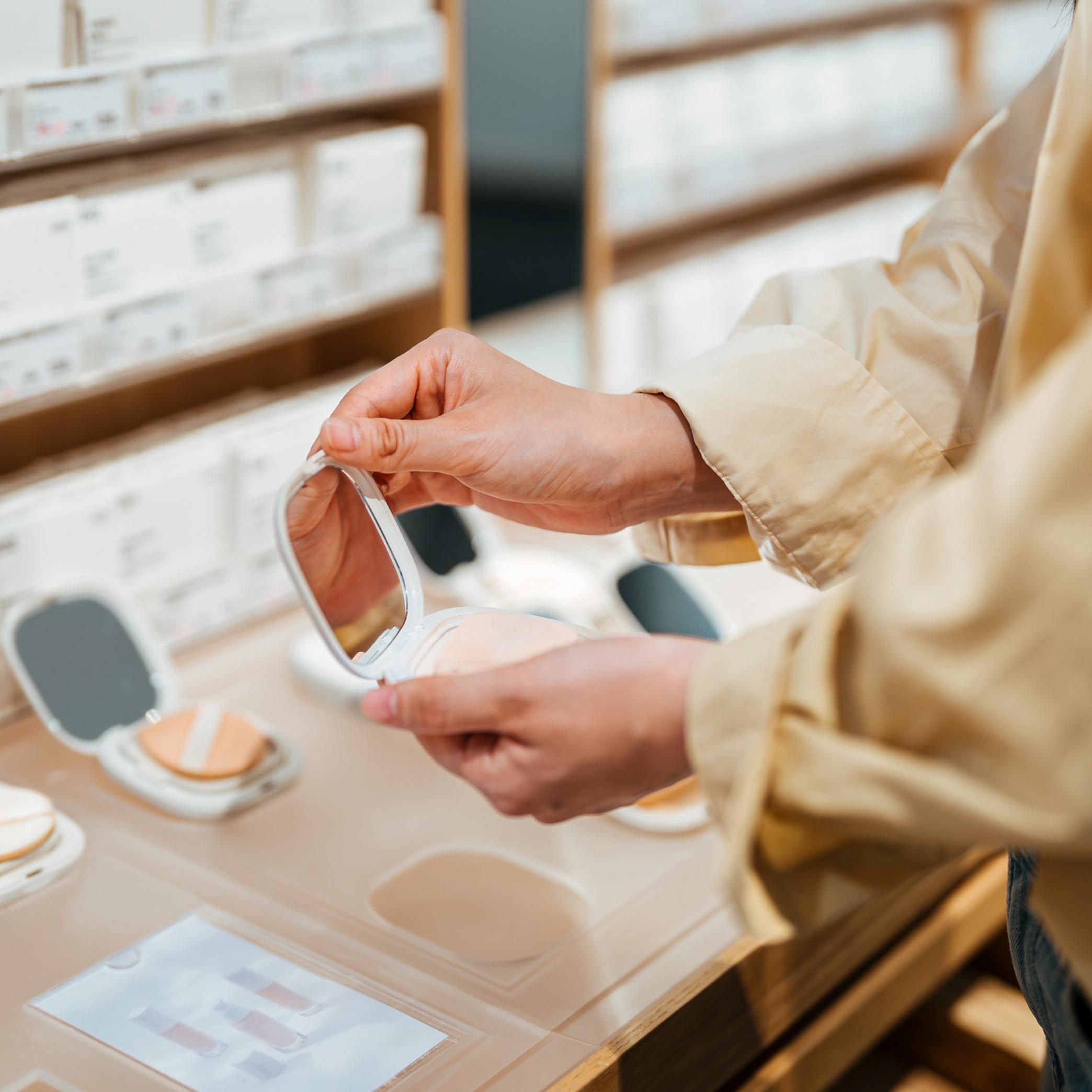 customer checking a product in a cosmetics store