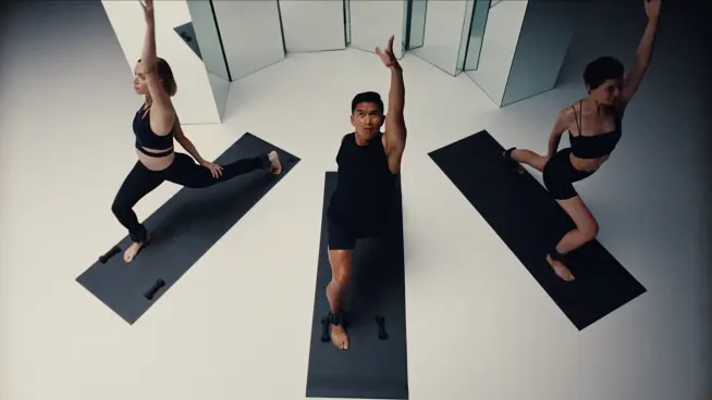 Adyen team members practicing yoga in the office environment.