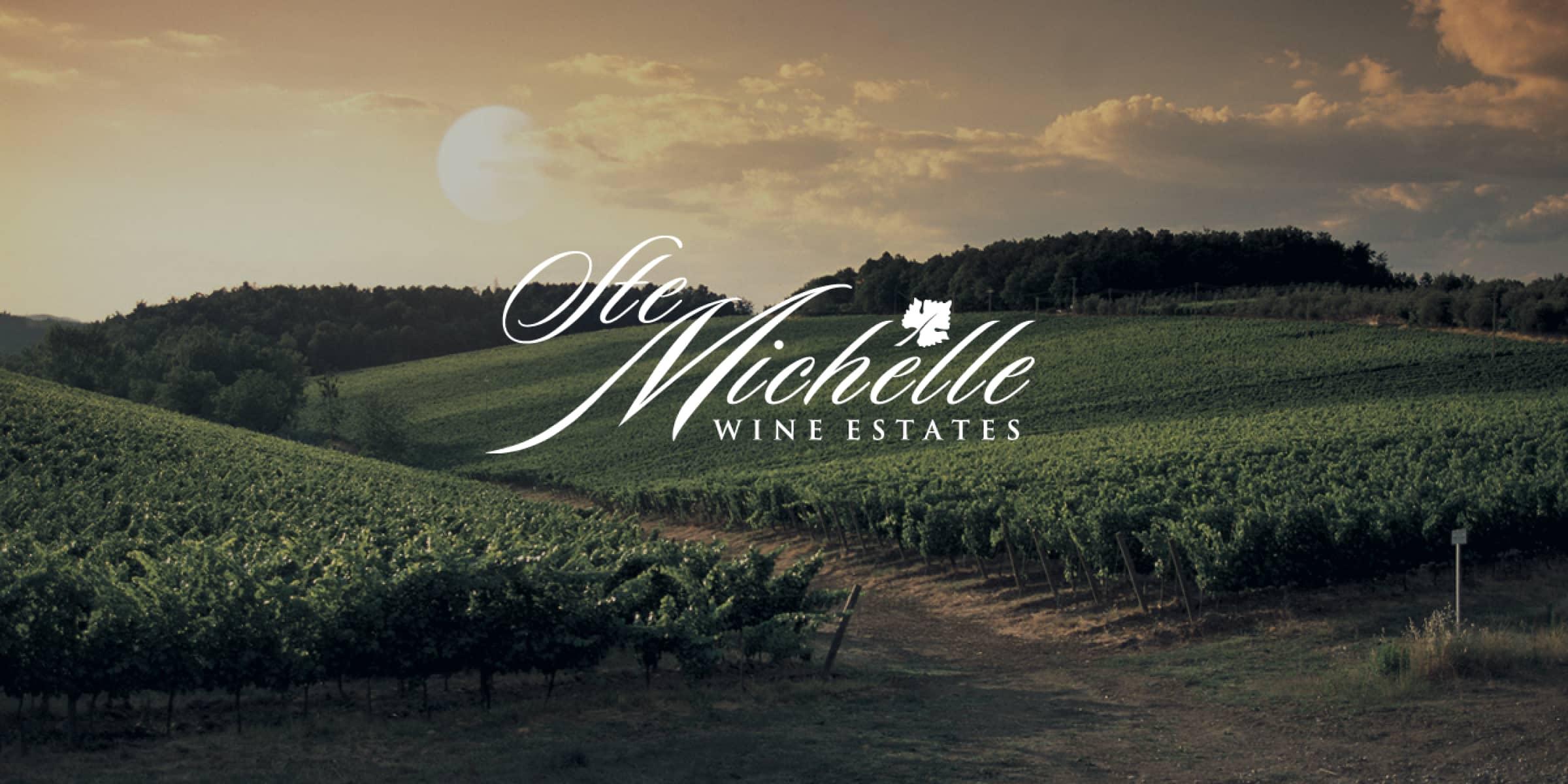 Ste Michelle Wine Estates logo over vineyard landscape at dusk.