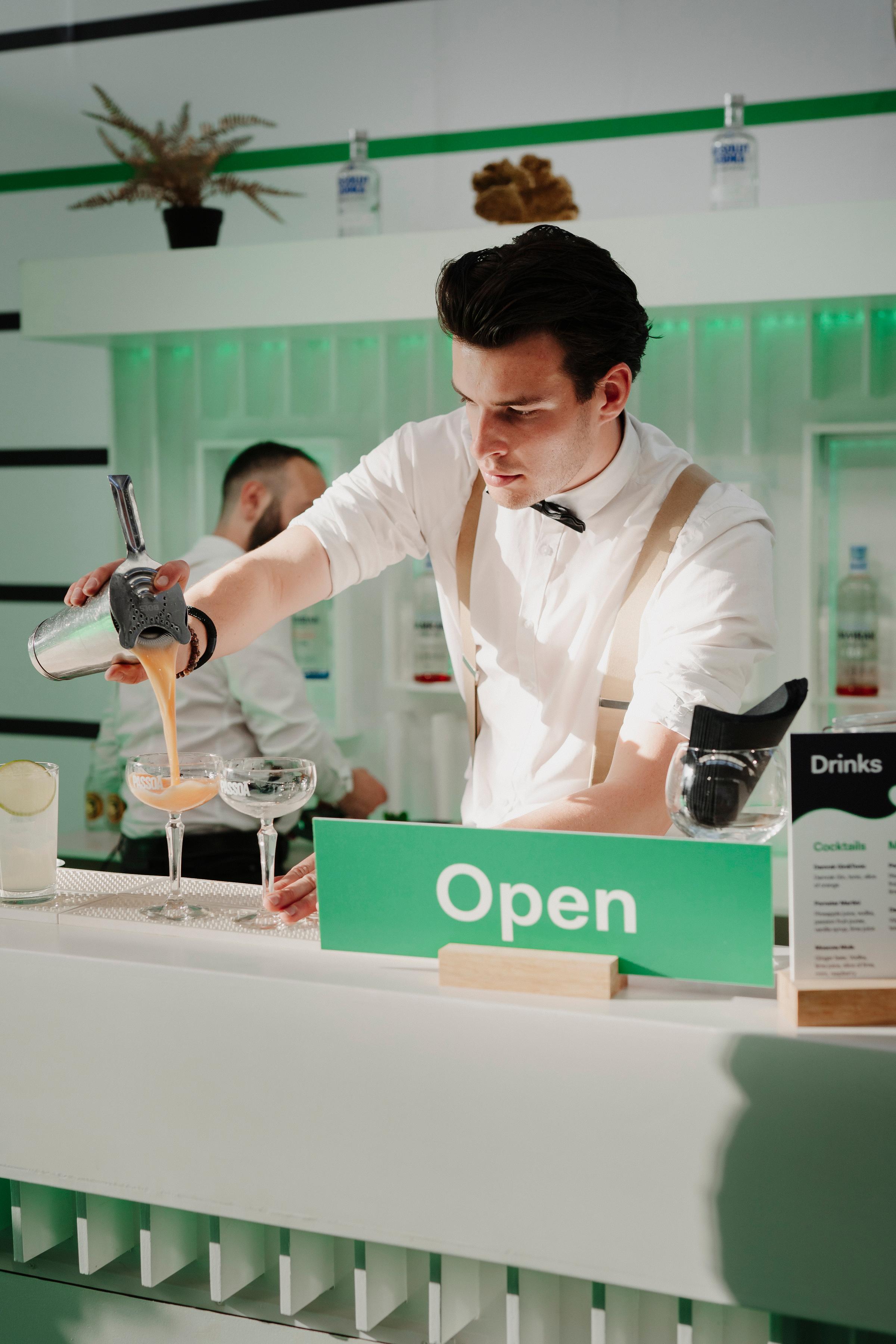A bartender preparing a cocktail