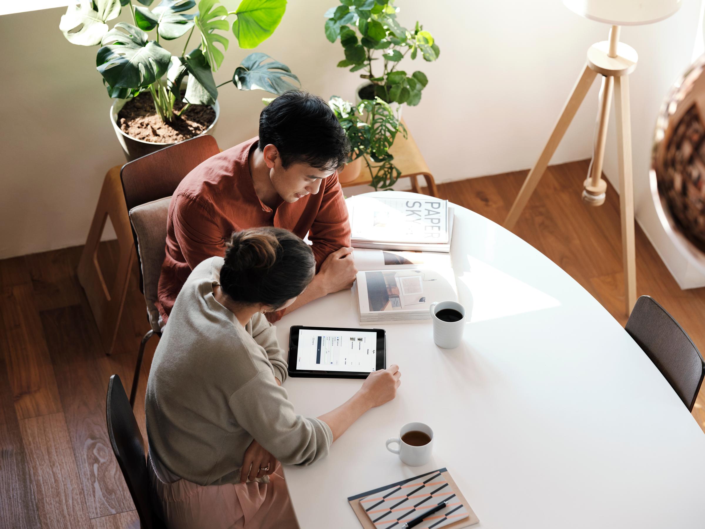 Couple at home shopping online on ecommerce website