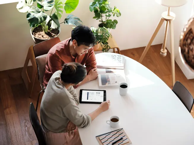 Couple at home shopping online on ecommerce website