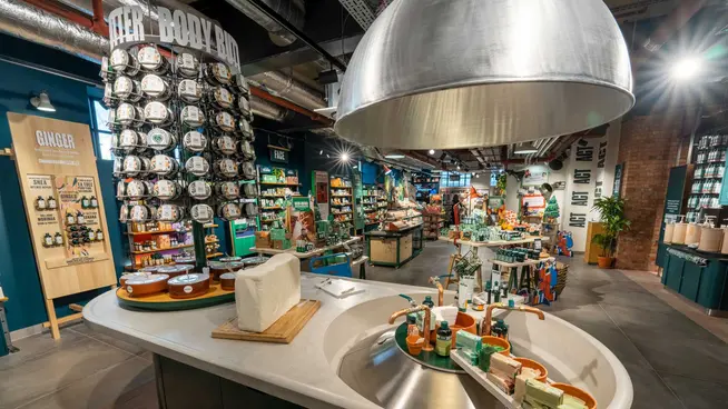 Interior of a modern retail store with various beauty products on display.