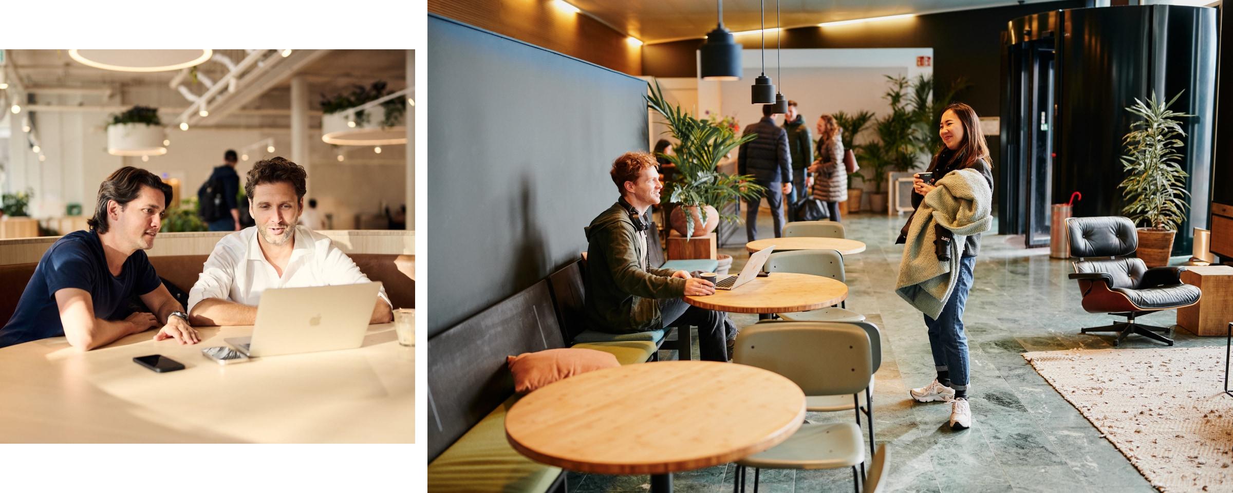 Deux professionnels discutant sur un ordinateur portable dans un espace de bureau moderne, collègues dans un espace de réunion informel.