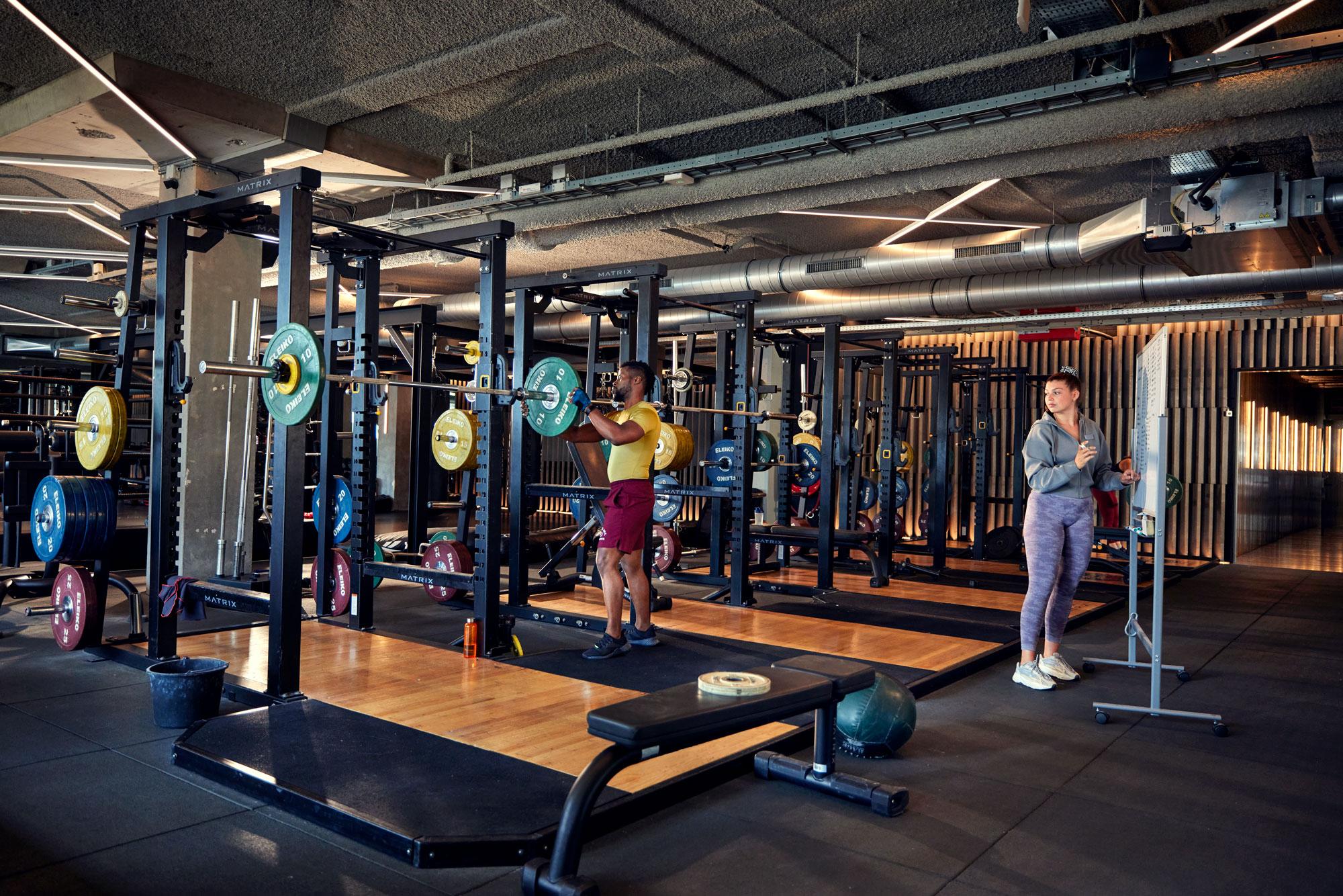 Gym employees preparing the room equipment for fitness classes