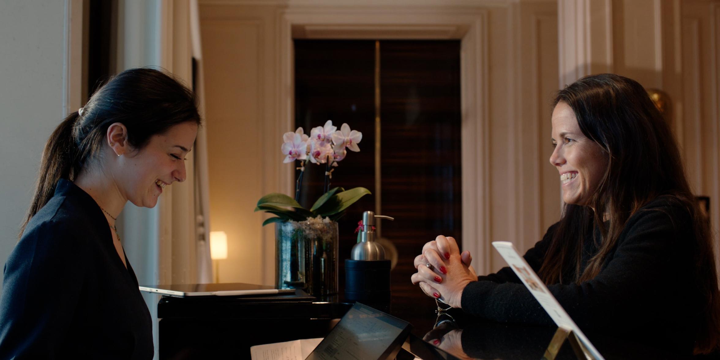 Two women at a luxury hotel reception