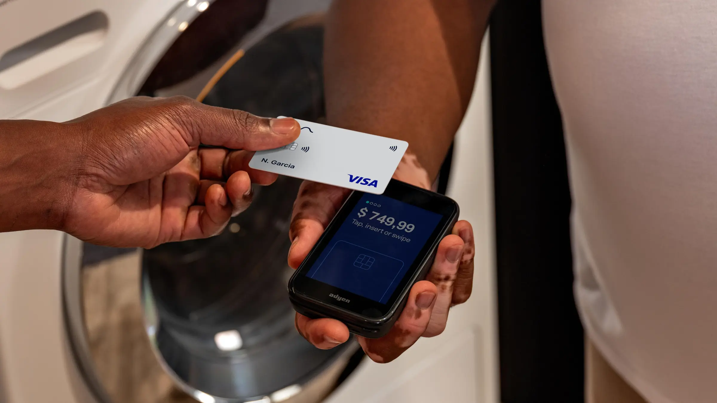 Customer using an Adyen card to pay via mobile terminal.