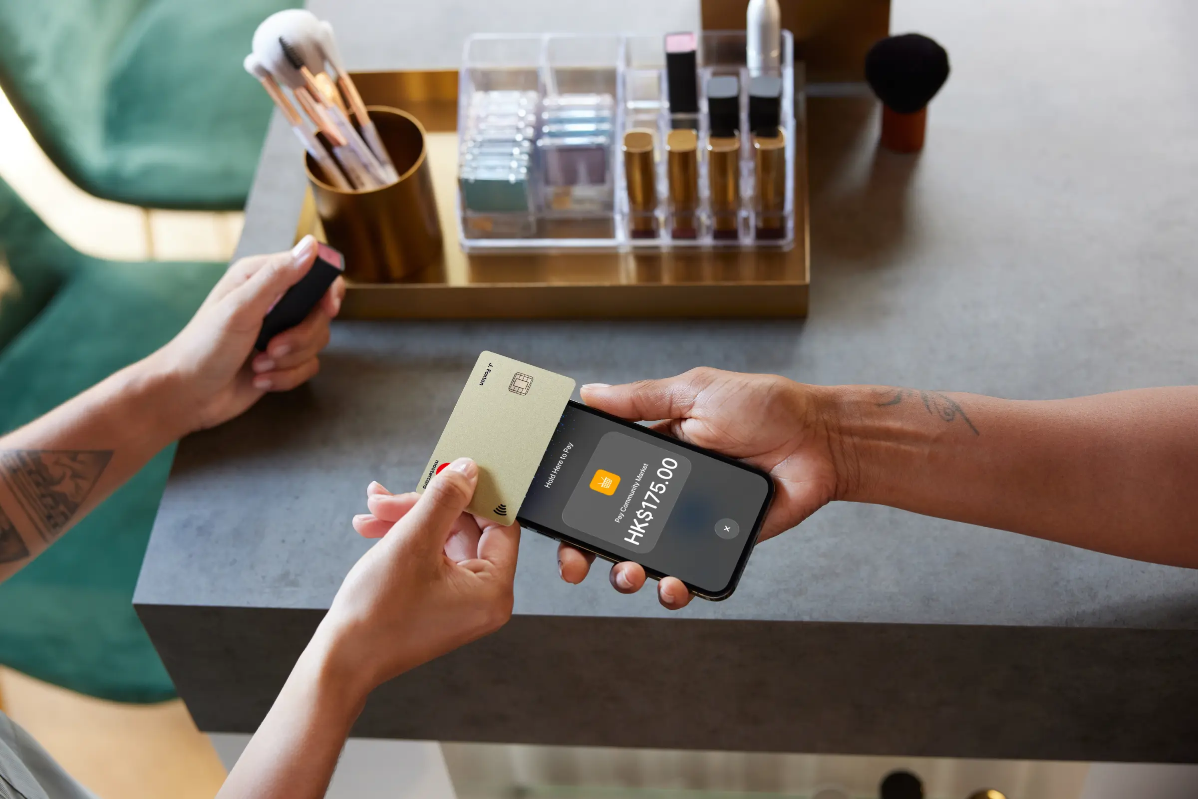 Customer making a contactless payment with an Adyen terminal at a retail counter