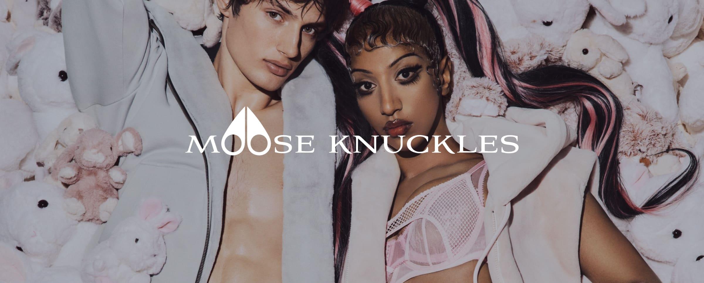 Two models posing with teddy bears