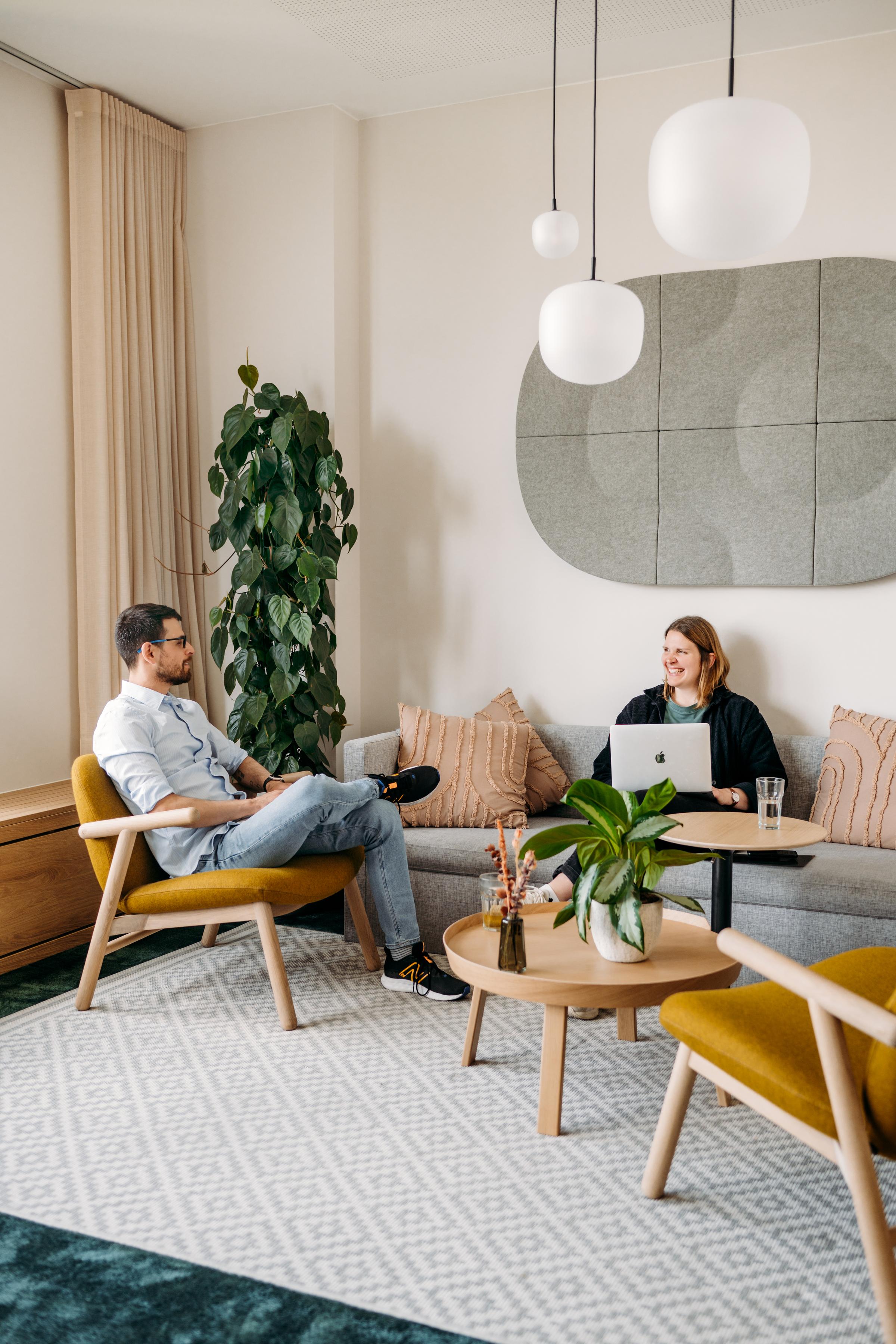 Two people sitting and working together