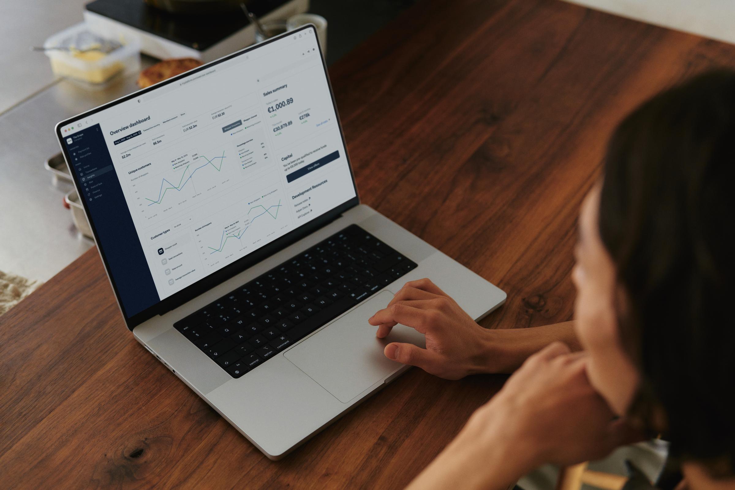 Restaurant owner on laptop using a SaaS platform