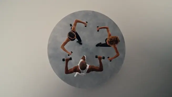 Overhead shot of three people lifting weights