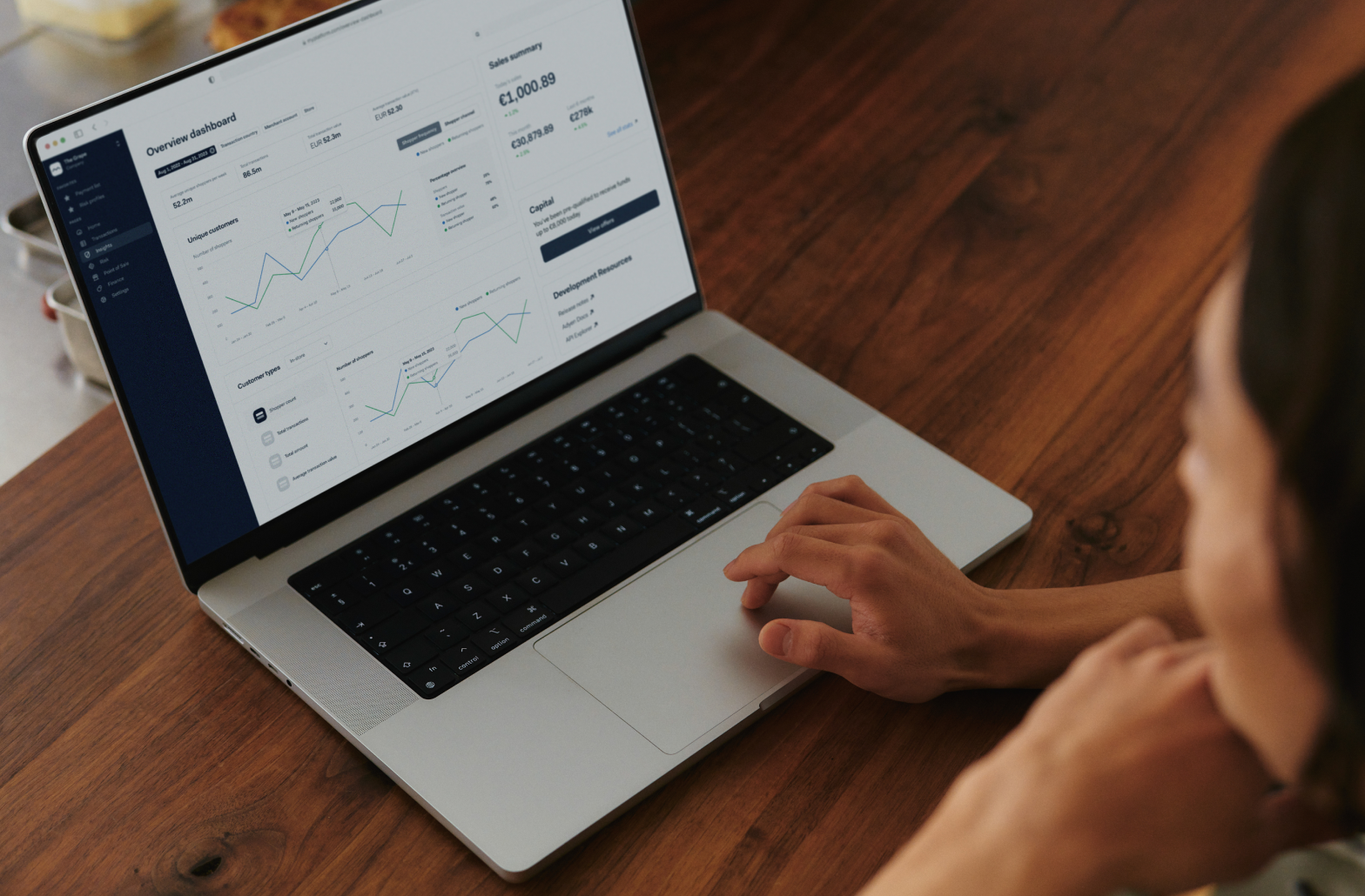 Person on laptop with dashboard view