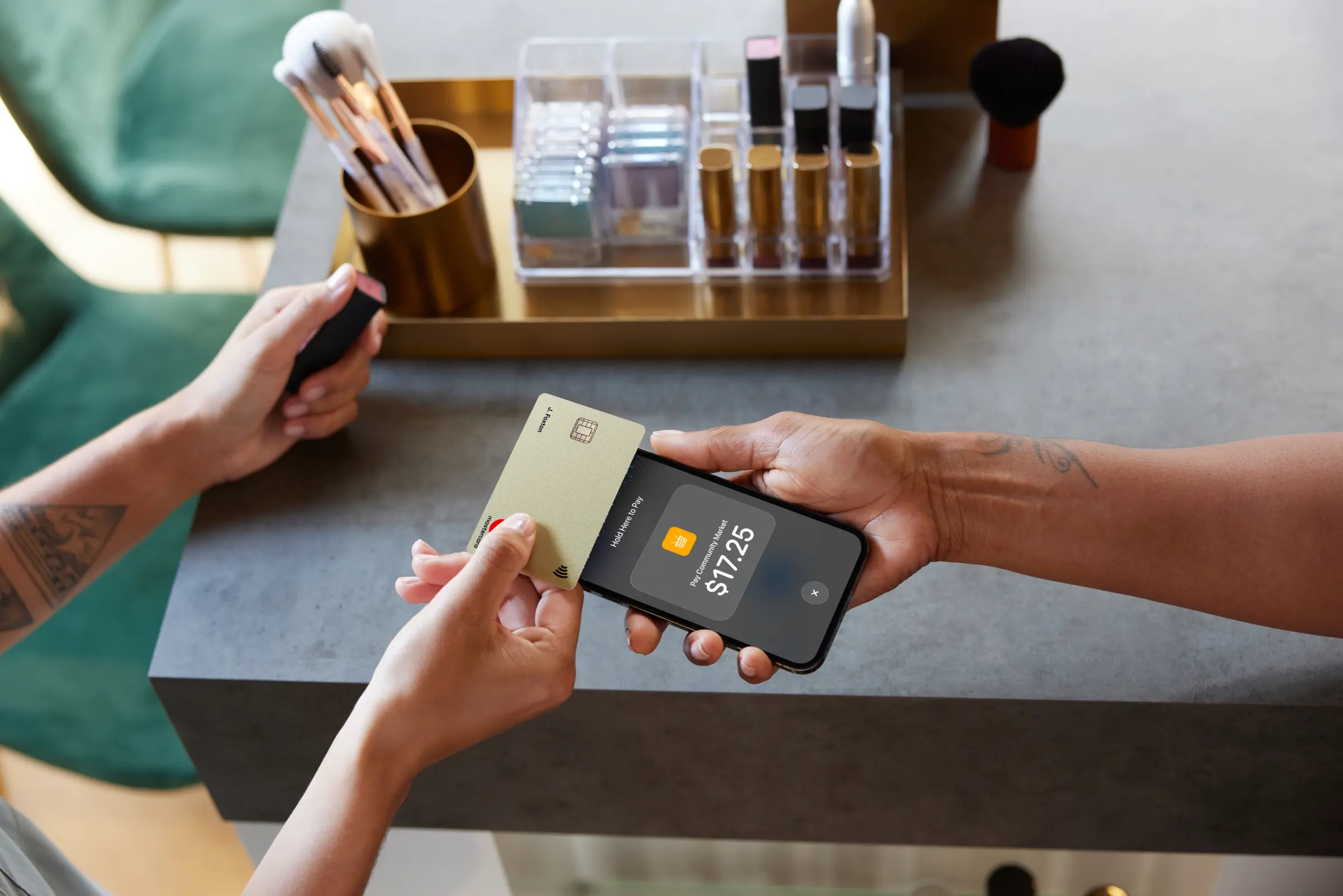 A customer pays with an Adyen card terminal in a modern retail setting.