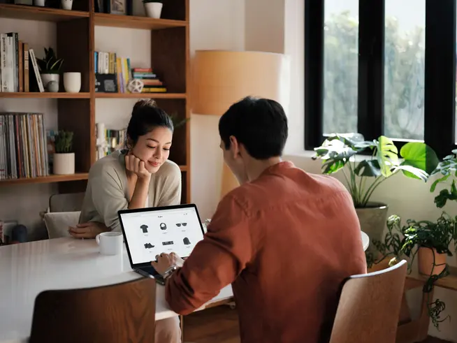 Couple at home shopping online on ecommerce website