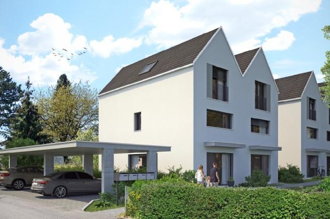 2 weisse Einfamilienhäuser von hinten mit Garage an der Eichenstrasse in Münchenstein