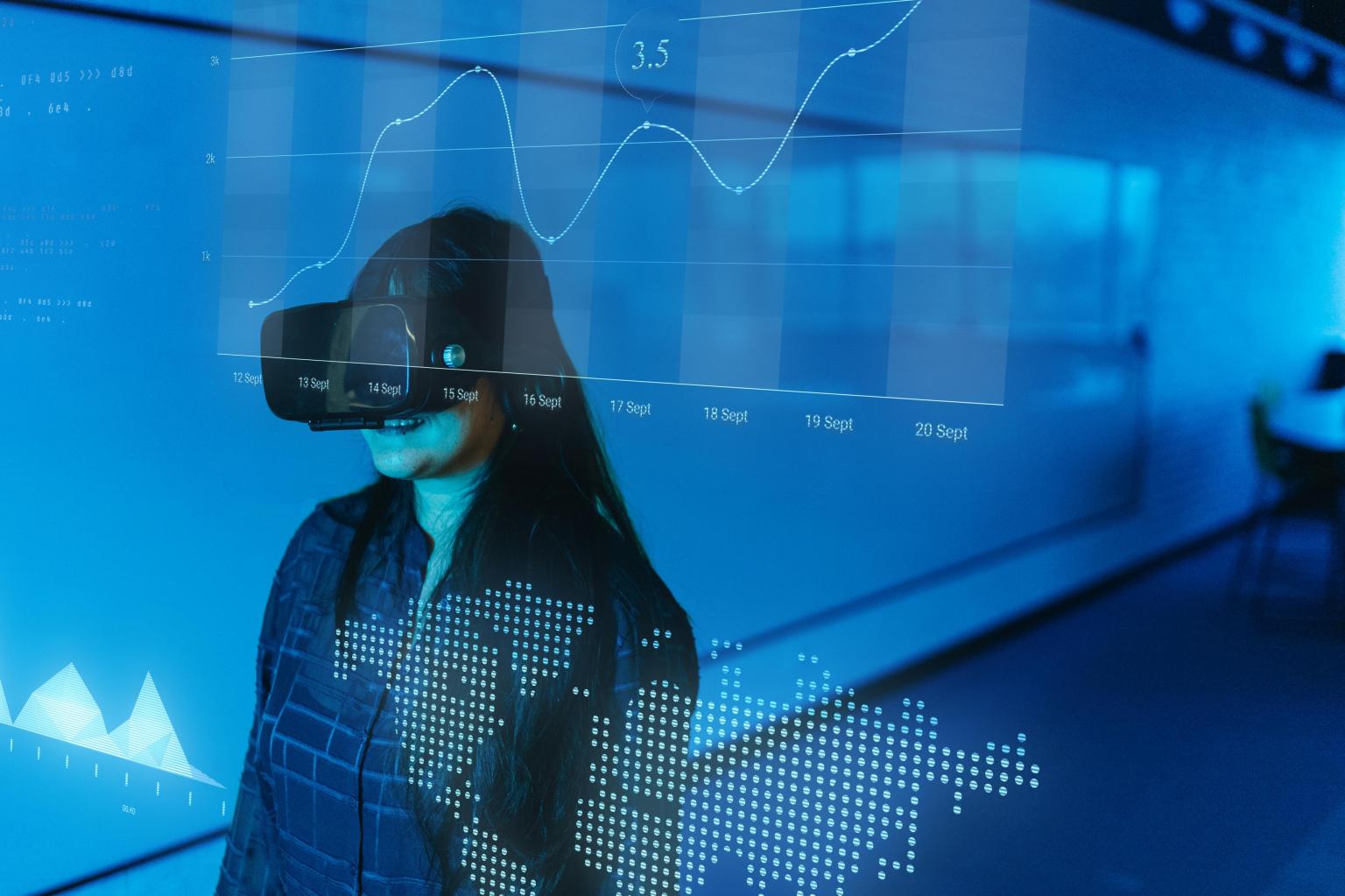 Frau vor digitaler Finanzanalyse mit Diagrammen und Datenvisualisierung. aus dem Artikel Zukunft KI: Wege und Wirkungen