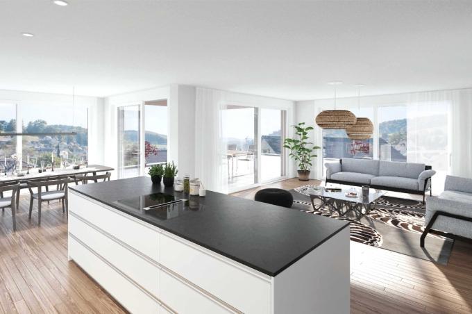 Wohnzimmer mit Küche, Esstisch, Stühlen und Balkon an der Lärchenstrasse im Bubendorf